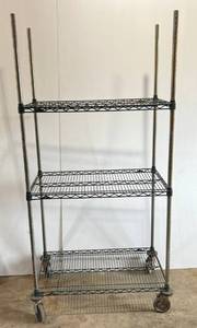 lot 129 image: Metal Rolling Rack With Metal Shelves Measures 75 T x 36 W x 21 D