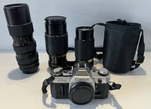 lot 279 image: Cannon AE- 1 With Lenses