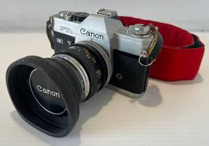 lot 299 image: Vintage Cannon FTB QL 35MM Camera With Lens