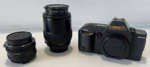 lot 311 image: Cannon T70 Camera, Lenses, Carrying Case And More