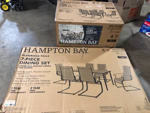 Hampton Bay Glenridge Falls 7-Piece Metal Outdoor Dining Set with Wood Finish Table and Rocking Sling Chairs in Putty Customer Returns See Pictures