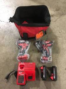 Milwaukee M18 18V Lithium-Ion Brushless Cordless Hammer DrillImpact Combo Kit (2-Tool) with 2 Batteries, Charger and Bag Customer Returns See Pictures