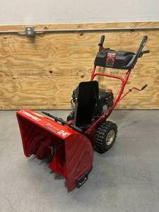 lot 10 image: TROY-BILT Storm 24 in. 208 cc Two- Stage Gas Snow Blower with Electric Start Self Propelled