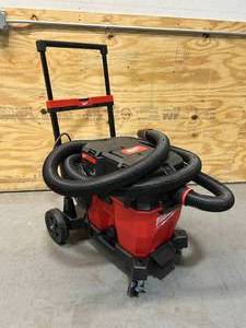 lot 28 image: MILWAUKEE 6.5 Peak HP WetDry Shop Vacuum Motor Head with 12 Gal. WetDry Shop Vacuum Tank and Premium WetDry Shop Vacuum Cart
