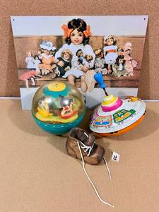 lot 55 image: Doll tin sign, FP Roll Poly, metal Top