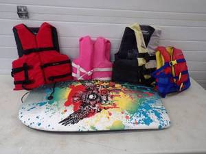 4 Life Jackets and Swim Board