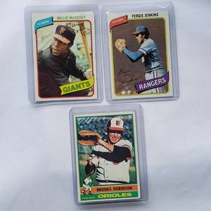 lot 51 image: Lot of 3 Willie McCovey 1980 Topps No. 335, Brooks Robinson 1976 Topps No. 95, Fergie Jenkins 1980 Topps No. 390