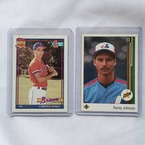 lot 83 image: Lot of 2 Randy Johnson Rookie 1989 Upper Deck No. 25, Chipper Jones Rookie #1 Draft Pick Topps No. 333