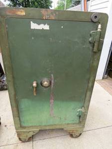 lot 57 image: Antique Safe without Complete Combination Lock on Wheels