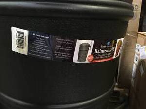 lot 38 image: EarthMinded RainStation 45 Gal. Recycled Black Rain Barrel with Diverter     Customer Returns See Pictures