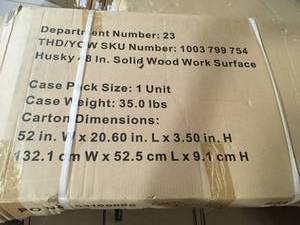 lot 54 image: Husky 48 in. Solid Wood Surface for Regular Duty Garage Storage System Customer Returns See Pictures