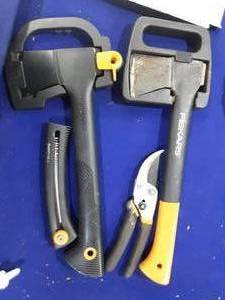 Fiskars hand saw, pruner and two hatchets