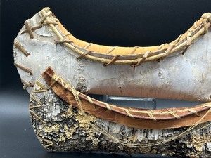 lot 33 image: Two Decorative Birch Canoe Figurines