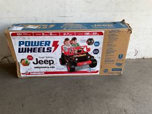 lot 24 image: Power Wheels 12V Black and Red Tough Talking Jeep Powered Ride-On