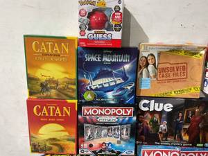 lot 102 image: LOT OF Board Games including Catan, Monopoly, Clue, Johnny the Skull. Pokemon Trainer Guess & Trivia, Disney Space Mountain, Unsolved Case Files, Scattergories, Twister Junior, Splendor & The Quacks of Quedlinburg