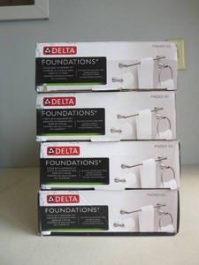 lot 314 image: LOT OF 4 Delta Foundations 3-Piece Bath Hardware Set in Stainless with Towel Ring Toilet Paper Holder and 18 in. Towel Bar