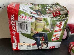lot 154 image: LOT OF 2 Tricycles - Radio Flyer Classic 10 inch Red and Deluxe Fold 2 Go Trike
