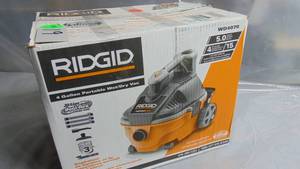lot 19 image: RIDGID 4 Gallon 5.0 Peak HP Portable WetDry Shop Vacuum with Fine Dust Filter, Locking Hose and Accessories Model # WD4070 UPC Code # 648846003399