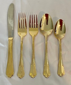 lot 14 image: Golden Flatware Grouping by Hampton Silversmiths