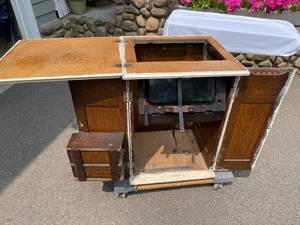lot 136 image: Vintage New Home Sewing Machine In Cabinet