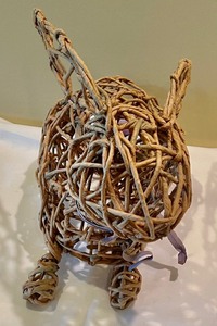 lot 80 image: Wicker Easter Bunny Figurine with Easter Eggs