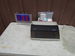 Electric typewriter with extra ink. Model SR1000. As shown.