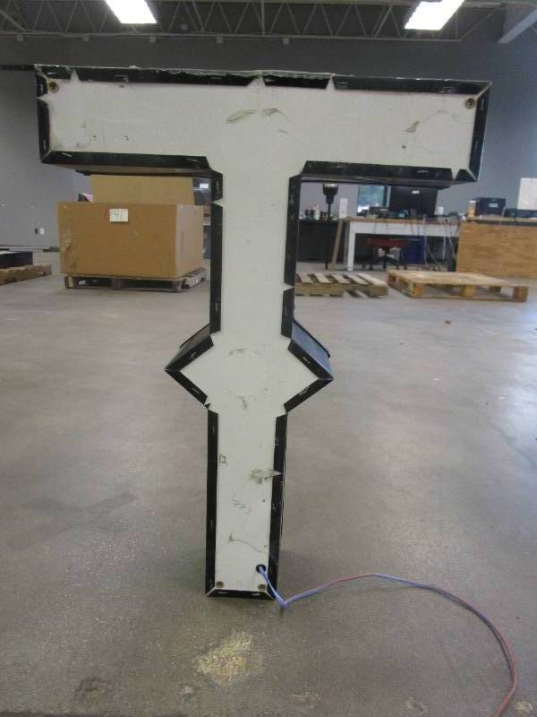 Lighted Letter T Outdoor Signage, Transformer Not Included. Approximate Dimensions 20 x 5.25 x 28 Tall - USED FOR RETAIL BRAND MN HOME OUTLET.