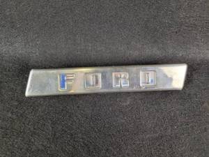 lot 1072 image: Vintage Embossed Metal FORD Emblem