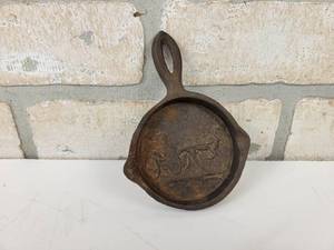 lot 973 image: Vintage WRIGHT Cast Iron Pan Ashtray - Horse & Buggy Scene