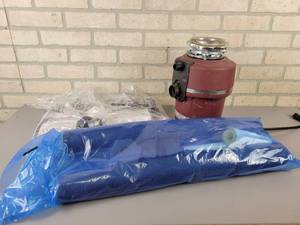 lot 555 image: Insinkerator Garbage Disposal - Tested and Works, Toilet install Kits and Pipe Insulation kit - NO SHIPPING