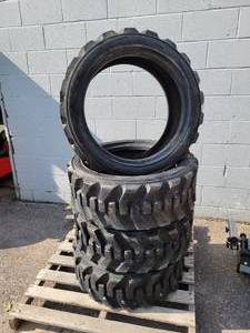 lot 550A image: (Set of 4) LSW 265-521 Skid loader Tires (Same as 10-16.5) - Low Profile - NO SHIPPING
