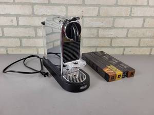 lot 895 image: Delonghi Nespresso Machine with Assorted Nespresso