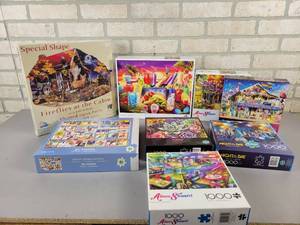 lot 899 image: (8) Assorted Puzzles - Buffalo Puzzles, Sunsout and More