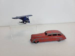 lot 110 image: Vintage Tootsie Toys - Red 6-Window Limo and UX214 Seaplane