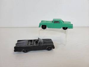 lot 111 image: Vintage Tootsie Toys - Black Chrysler and Aqua Ford Thunderbird