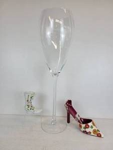 lot 34 image: Oversized Wine Glass with High-Heeled Wine Bottle Holder and More