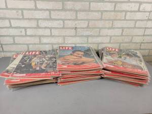 lot 25 image: (50) 1950s Issues of LIFE Magazine - All are in Plastic Sleeves