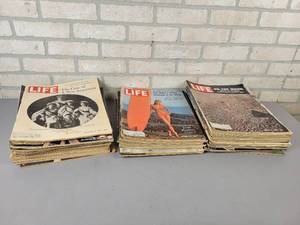 lot 24 image: (50) 1960s Issues of LIFE Magazine