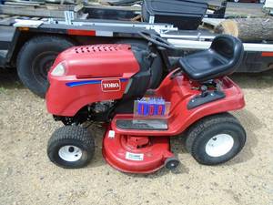 Toro Lawn tractor. 17.5 hp. 5 speed with hilo. Runs great. Very clean. New battery. THIS ITEM HAS A RESERVE.