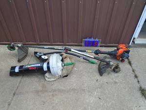 Remington weed trimmer with multiple accessories. As shown.