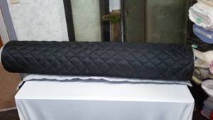 lot 235 image: Polyester Quilted Padded Lining Fabric.