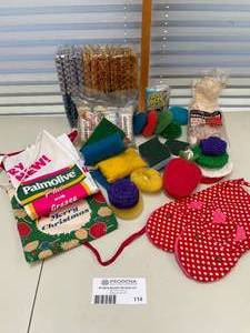 lot 114 image: Lot of Cleaning Supplies, Scrubbing Pads, Oven Mitts, Aprons and more