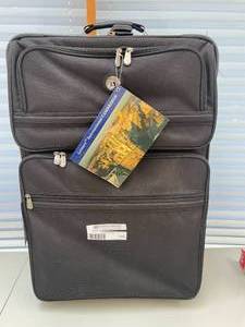 lot 115 image: NEW Leisure International Large Expandable Rolling Suitcase