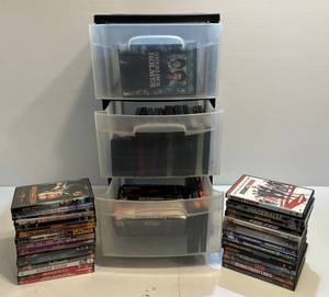 lot 36 image: Plastic Three Drawer Storage Bin Filled With DVDs