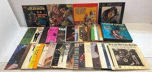 lot 99 image: Group Of Vintage Records Including 007 Goldfinger, The Good, The Bad And The Ugly And The Monkees