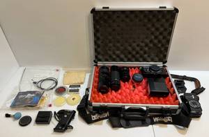 lot 204 image: Vintage Cannon FDb QL 35mm SLR Film Camera, Lenses, Flashes Hard Case And More (Everything You Need)