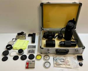lot 205 image: Vintage Cannon F-1 With Power Winder, Lenses, Angle Finder, Hardcase And More (Awesome Lot)