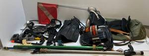 lot 218 image: Vintage Scuba Diving Gear Including Finns, Diving Flag, Mask, Suit, Spear Guns, Tank Mount,  And More