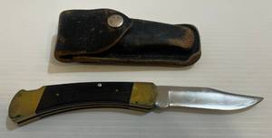 lot 296 image: Buck 110 Folding Hunting Lockback Pocket Knife With Sheath