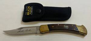 lot 303 image: 2002 100th Year Buck Folding Pocket Knife With Chuck Buck On Blade wSheath